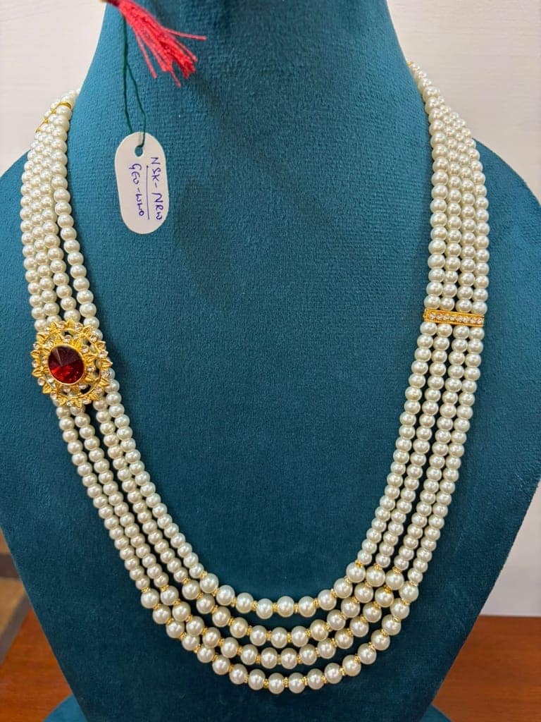 groom and party wear red stone white pearl necklace view 2