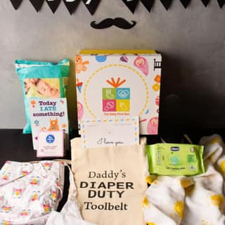 The Baby First Box Daddy's Duty Toolkit Gift For New Dads (Apron, Quick Dry Sheet, Disposable Diapers, Cotton Diapers For Babies, Diaper Rash Cream And 18 Milestone Cards),1 Count