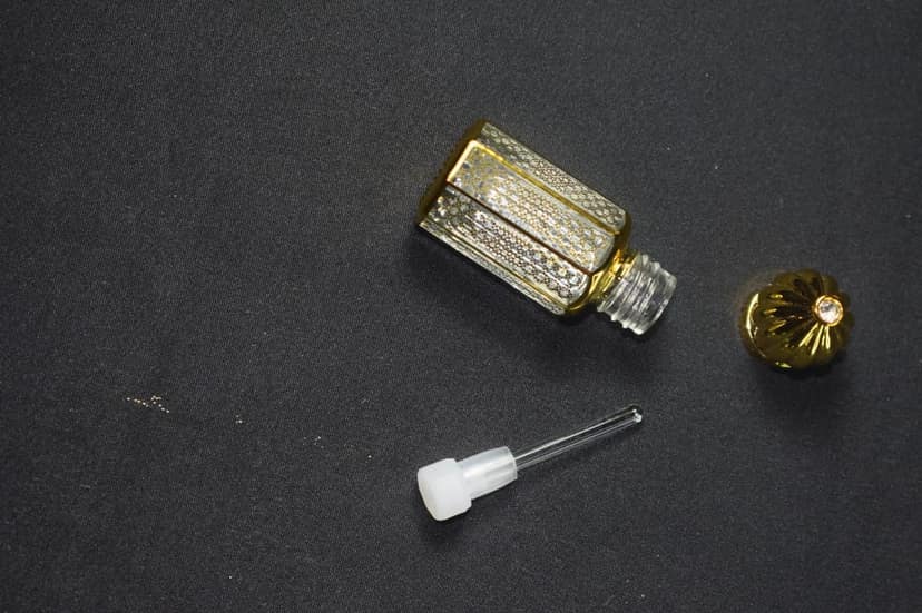 Sophia "Crafted with Care: Golden Ornate Perfume Bottle - A Treasure for Your Senses" view 2