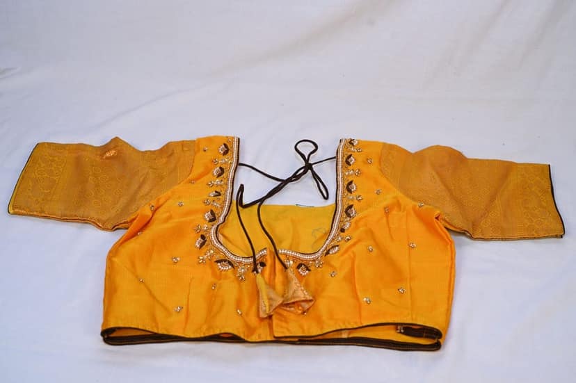 Yellow blouse with golden embroidery